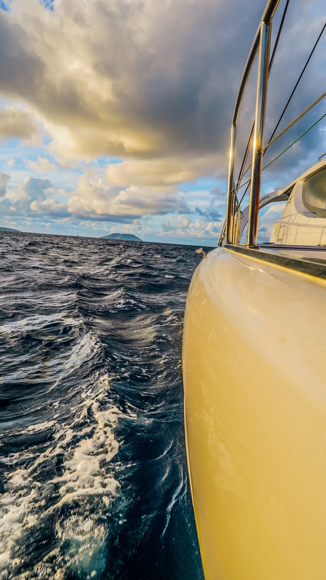 Stella Blue catamaran underway with Caribbean wake and sky in the USVI