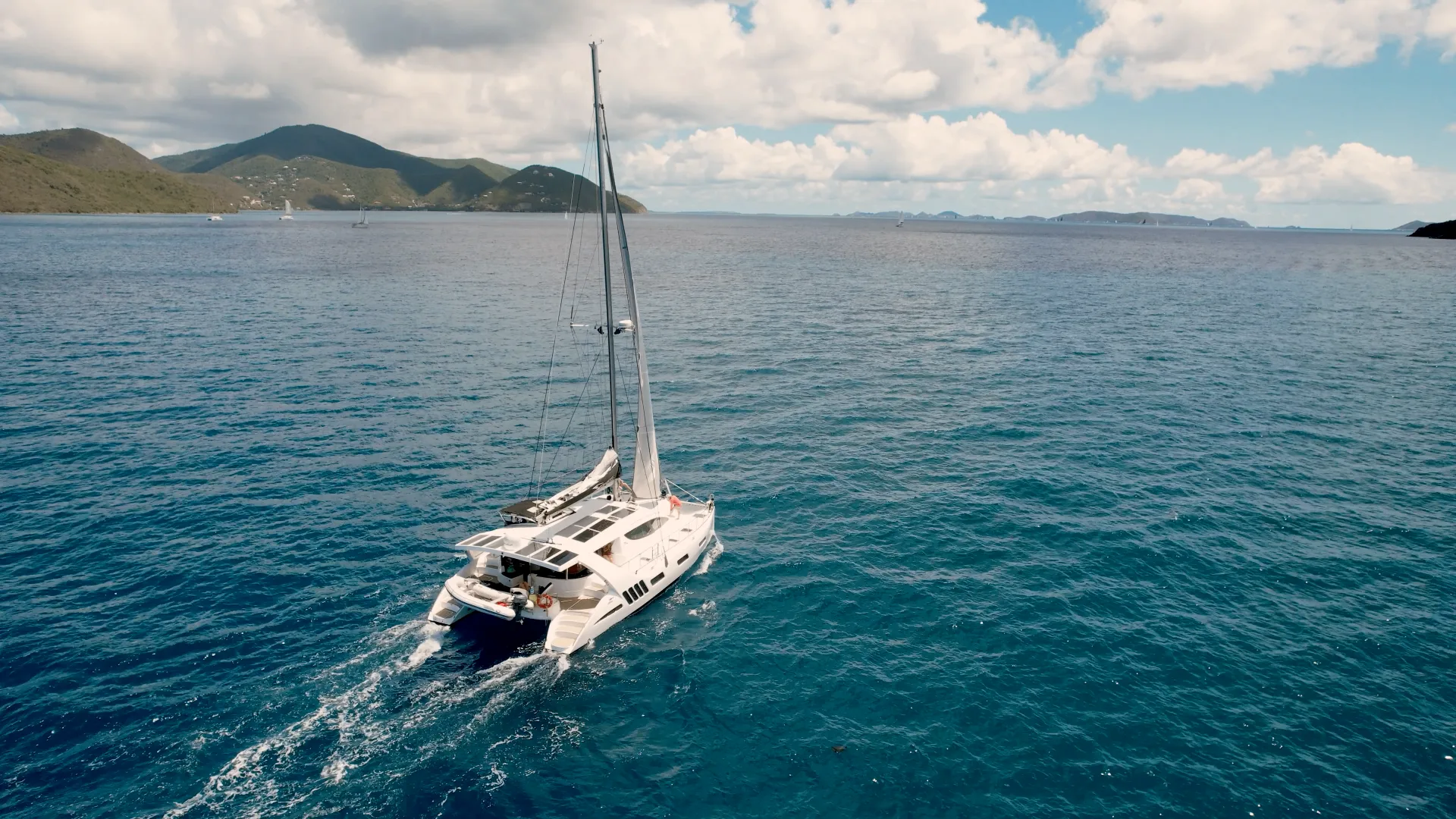 Closer aerial view of Stella Blue Xquisite X5 catamaran sailing across the Virgin Islands
